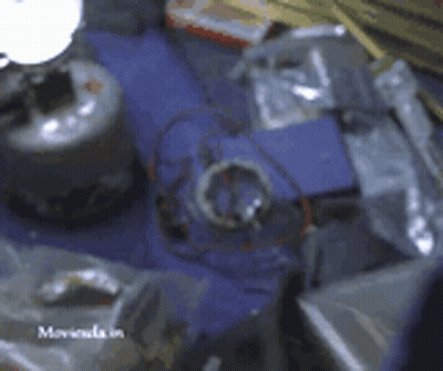 A Blurred Image Of A Table With The Word Moviola In The Bottom Right Corner GIF