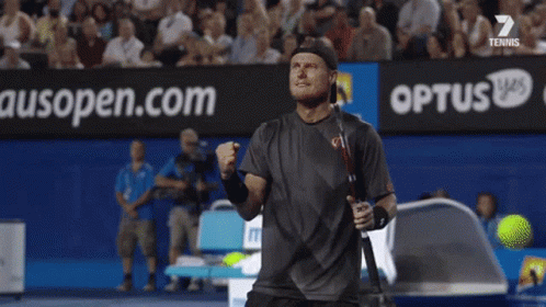 A Blurred Image Of A Tennis Court With An Ad For Medibank GIF