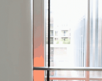 A Blurred Image Of A Window With A White Wall In The Background GIF