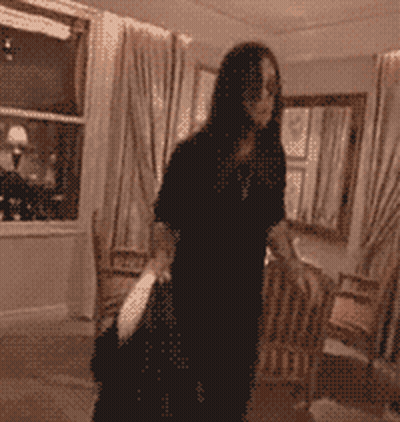 A Blurred Image Of A Woman Dancing In A Room GIF