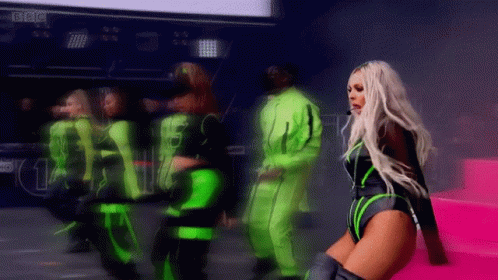 A Blurred Image Of A Woman Dancing With The Word Bbc In The Background GIF