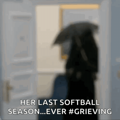 A Blurred Image Of A Woman Holding An Umbrella With The Words Her Last Softball Season Ever Grieving GIF