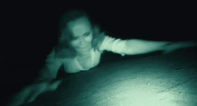 A Blurred Image Of A Woman Laying On The Ground GIF