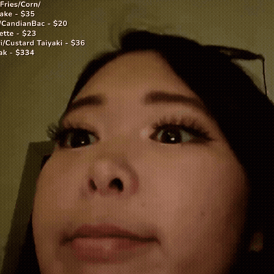 A Blurred Image Of A Woman 'S Face With The Word Dafug Written Above Her GIF