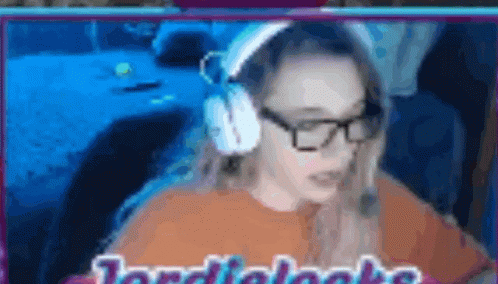 A Blurred Image Of A Woman Wearing Headphones And Glasses With The Words Jordi Looks Written On The Bottom GIF