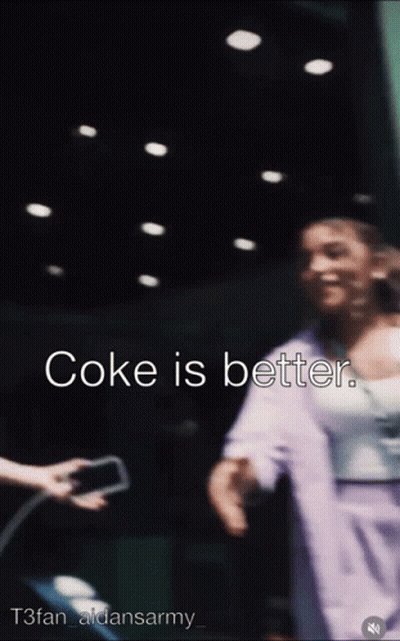 A Blurred Image Of A Woman With The Words Coke Is Better On The Bottom GIF