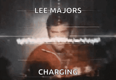 A Blurred Image Of Lee Majors Charging GIF