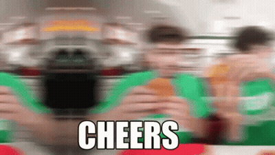 A Blurred Image Of People Eating Hamburgers With The Words Cheers Written On The Bottom GIF