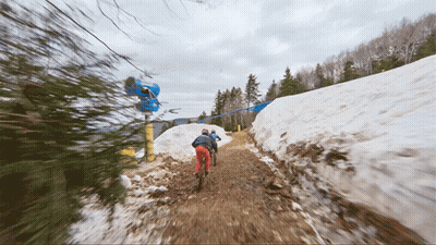 A Blurred Image Of People Walking Down A Snow Covered Path GIF