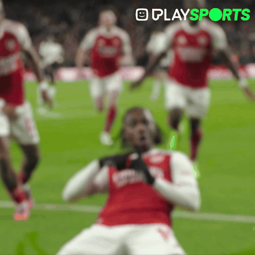 A Blurred Image Of Soccer Players With The Words Playsports In The Upper Right Corner GIF