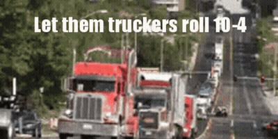 A Blurred Image Of Trucks On A Highway With The Words Let Them Truckers Roll 10-4 GIF