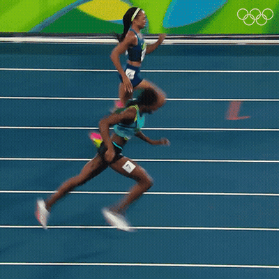 A Blurred Image Of Two Women Running On A Track With The Number 4 On The Bottom GIF