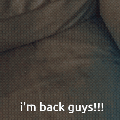 A Blurred Image With The Words I 'M Back Guys Written Below It GIF