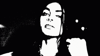 A Blurry Black And White Photo Of A Person 'S Face With Smoke Coming Out Of It . GIF
