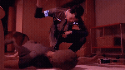 A Blurry Image Of A Man Kneeling On A Woman 'S Stomach GIF