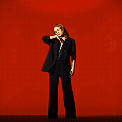 A Blurry Image Of A Person 'S Face In A Red Background GIF