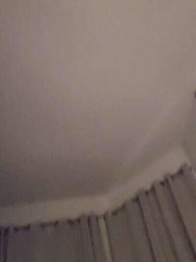 A Blurry Image Of A Person 'S Face With A Pink Background GIF