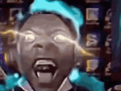A Blurry Image Of A Person With Their Mouth Open GIF