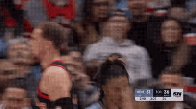 A Blurry Photo Of A Basketball Game With A Scoreboard That Says Mem 51 Tor 36 Sn GIF