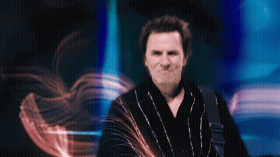 A Blurry Photo Of A Man In A Black Robe GIF
