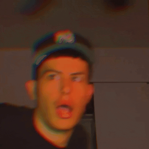A Blurry Photo Of A Man Wearing A Hat That Says ' Rs ' On It GIF
