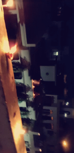 A Blurry Photo Of A Street At Night With A Few Lights On GIF