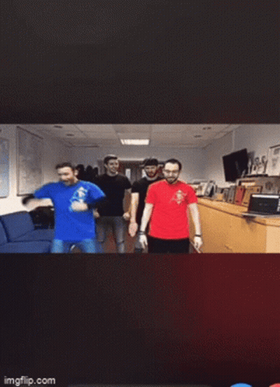 A Blurry Photo Of People Dancing In Front Of A Cse Sign GIF