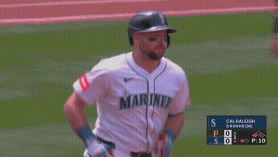 A Blurry Picture Of A Baseball Game With Cal Raleigh GIF