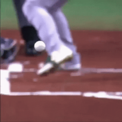 A Blurry Picture Of A Baseball Player Getting Ready To Catch The Ball GIF