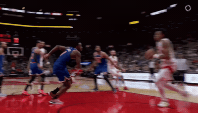 A Blurry Picture Of A Basketball Game With The Number 7 On The Back Of A Player 'S Jersey GIF