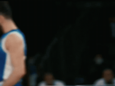 A Blurry Picture Of A Basketball Player Wearing A Blue And White Jersey With The Number 1 On It GIF