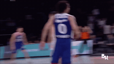 A Blurry Picture Of A Basketball Player Wearing A Number 10 Jersey GIF