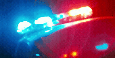 A Blurry Picture Of A Blue And Red Light GIF