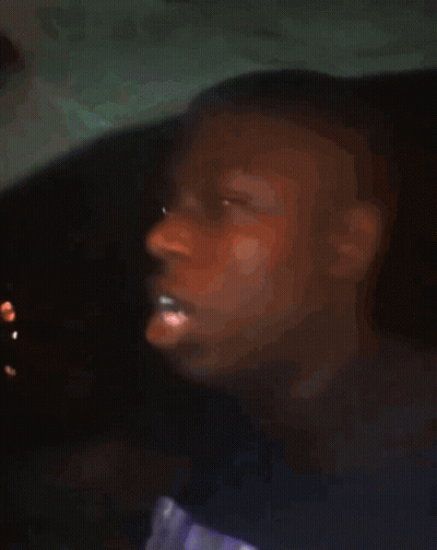 A Blurry Picture Of A Boy With His Eyes Closed GIF