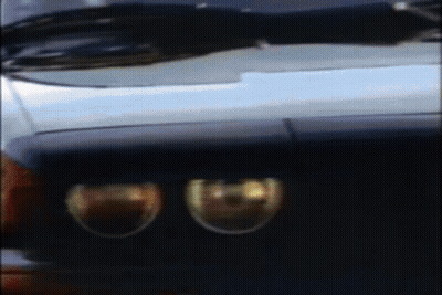 A Blurry Picture Of A Car 'S Headlights And Windshield GIF