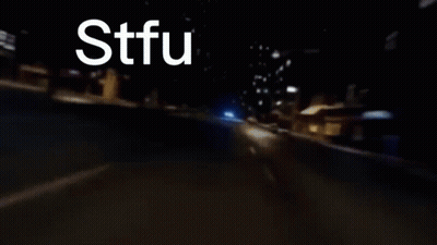 A Blurry Picture Of A Car With Stfu Written On It GIF