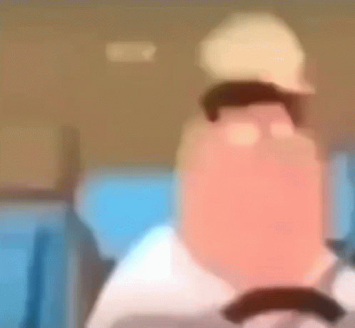 A Blurry Picture Of A Cartoon Character With A Hat On His Head . GIF