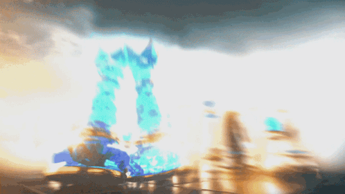 A Blurry Picture Of A Castle With A Blue Tower In The Background GIF