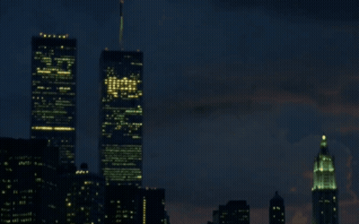 A Blurry Picture Of A City At Night With A Few Buildings Lit Up GIF
