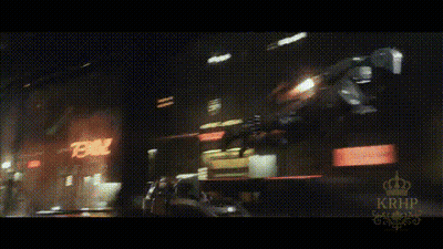 A Blurry Picture Of A City At Night With A Sign That Says 78 On It GIF