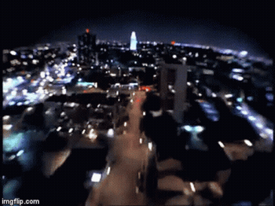 A Blurry Picture Of A City At Night With The Words Imgflip.com On The Bottom Right GIF