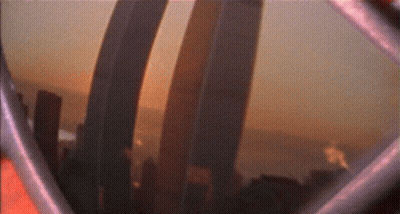 A Blurry Picture Of A City Skyline With A Few Buildings In The Foreground GIF