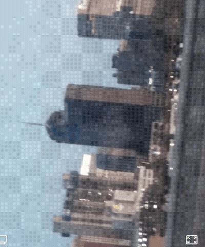 A Blurry Picture Of A City Skyline With A Few Buildings Visible GIF