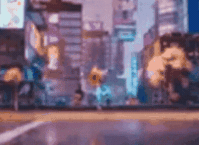 A Blurry Picture Of A City Street With A Yellow Sign That Says ' A ' On It GIF