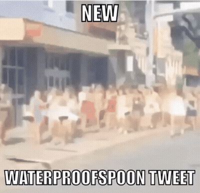A Blurry Picture Of A Crowd Of People Walking Down A Street With The Caption " New Waterproofspoon Tweet " GIF