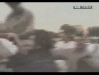 A Blurry Picture Of A Crowd With A Fox Sports Logo GIF