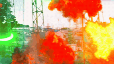 A Blurry Picture Of A Fire With A Green Light In The Foreground GIF