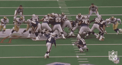 A Blurry Picture Of A Football Field With The Nfl Logo In The Foreground . GIF