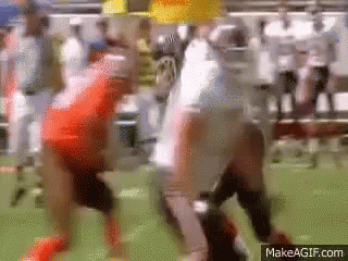 A Blurry Picture Of A Football Game With The Website Makeagif.com In The Corner GIF