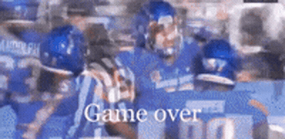A Blurry Picture Of A Football Game With The Words Game Over In The Corner . GIF